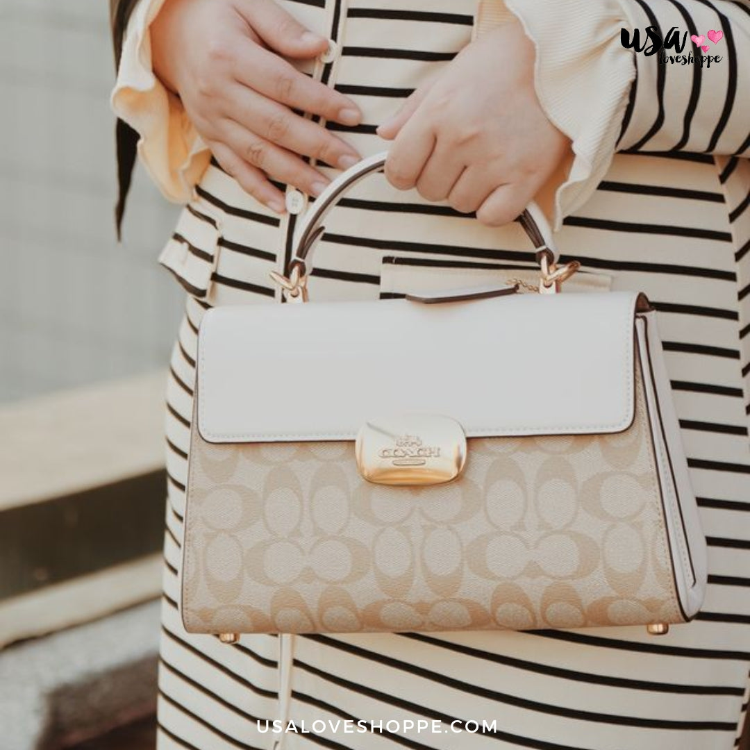 Unveiling the Coach Eliza Top Handle in Signature Canvas: A Tale of Elegance