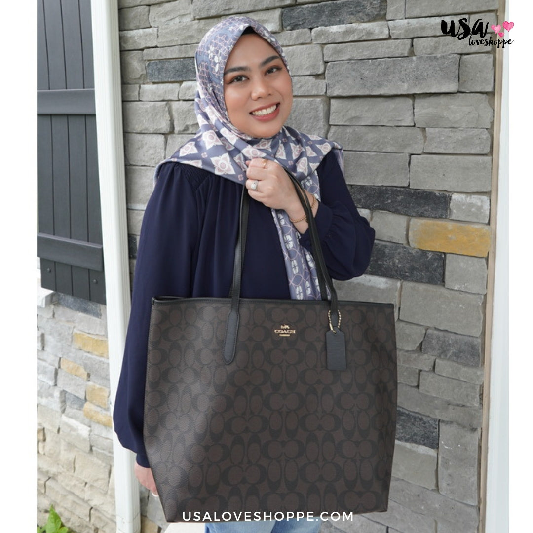 Introducing the Timeless Elegance of the Coach Signature Open City Tote in Brown/Black