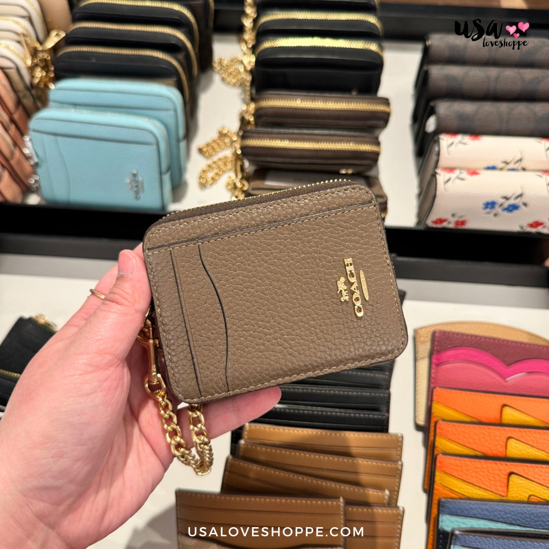 Discover Elegance and Functionality with Coach Zip Card Case in Dark Stone