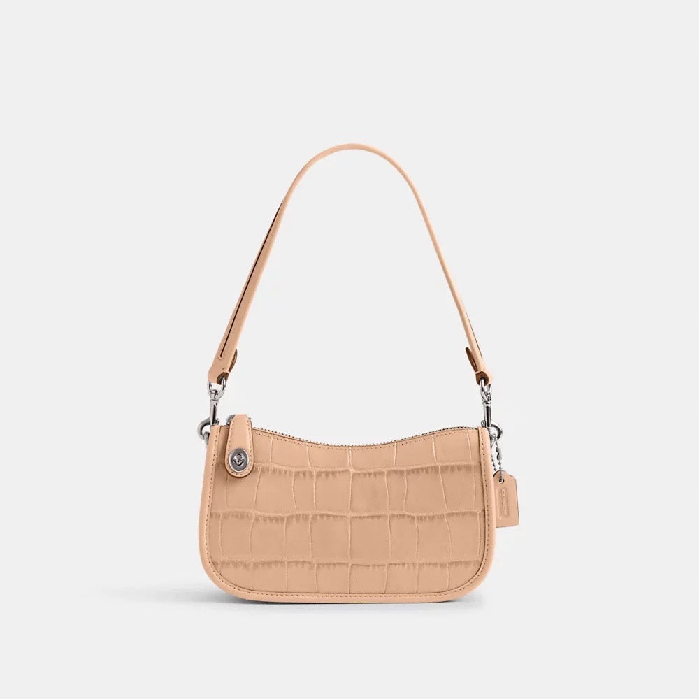 Discover the Exquisite Coach Swinger Bag 20 – A Statement of Luxury at Unbeatable Prices