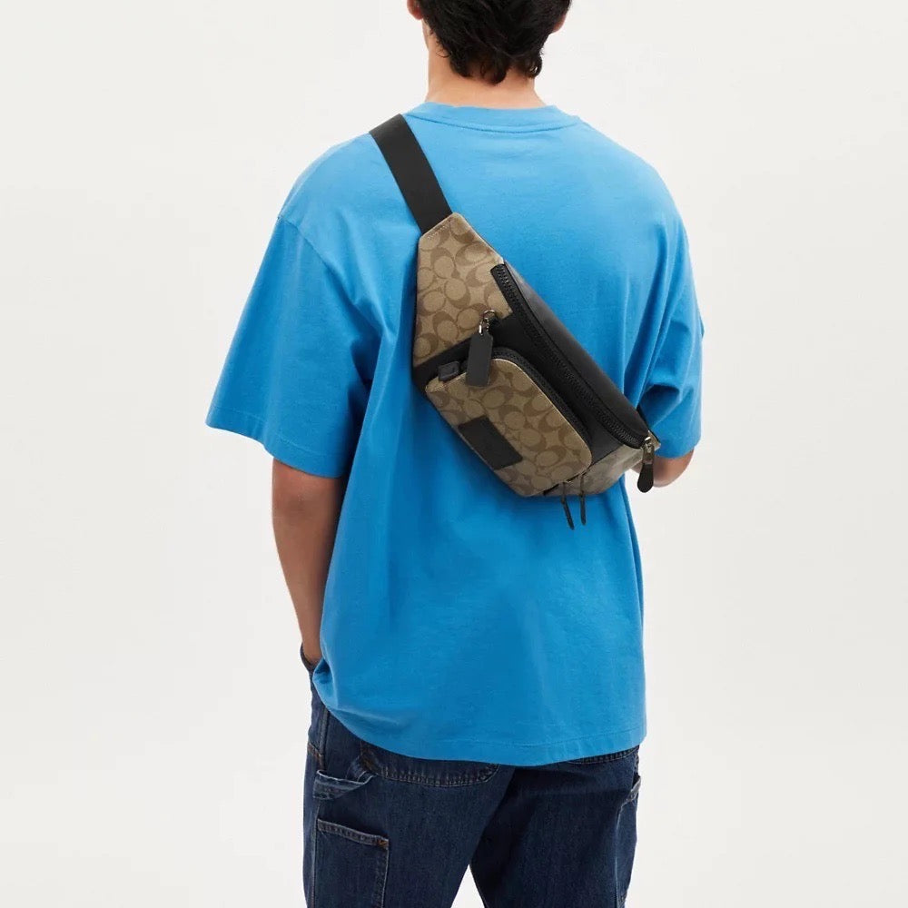 Your Go to Accessory The Coach Track Belt Bag in Signature Canvas