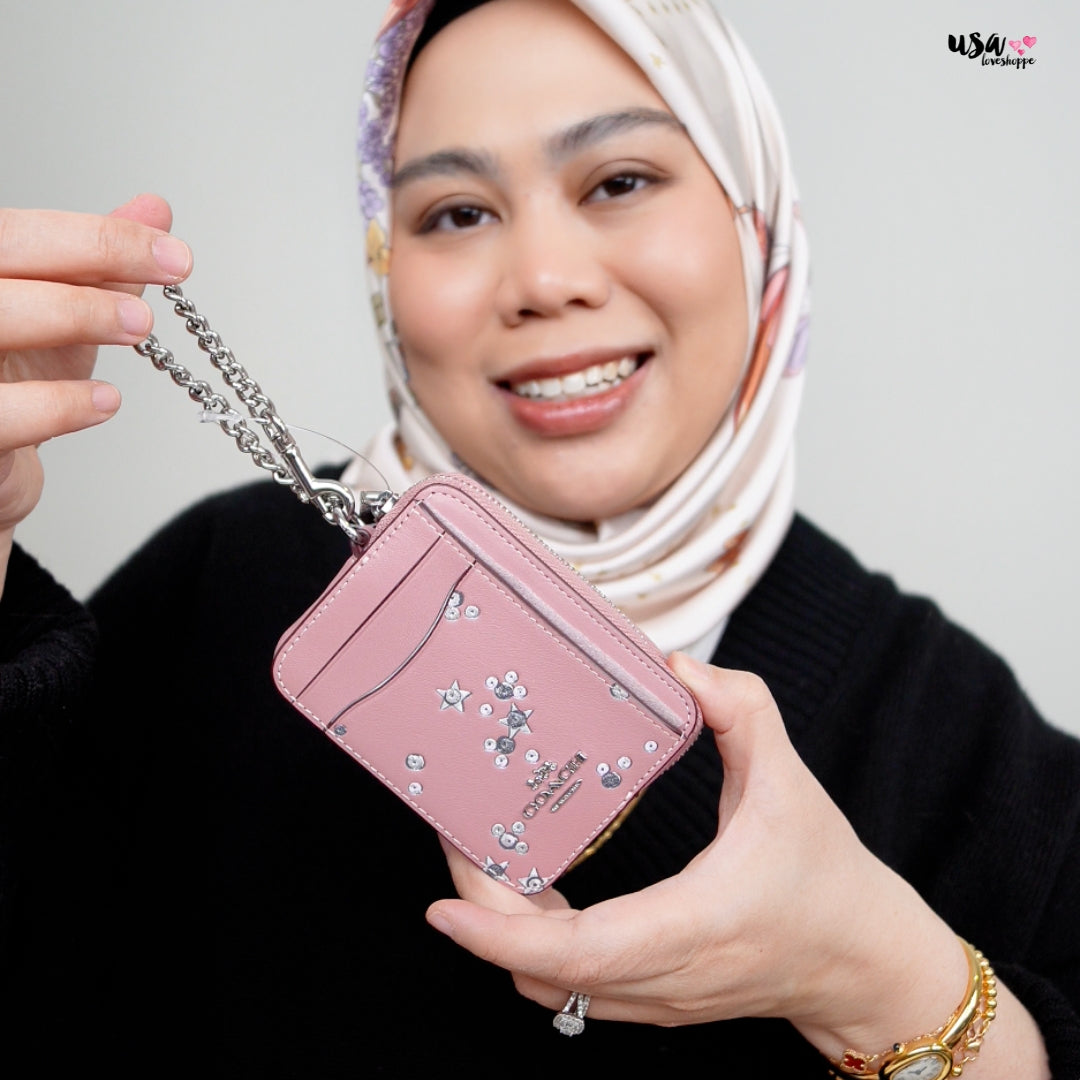 Sparkle with Style: Why the Coach Zip Card Case with Star Print Is a Must-Have Accessory