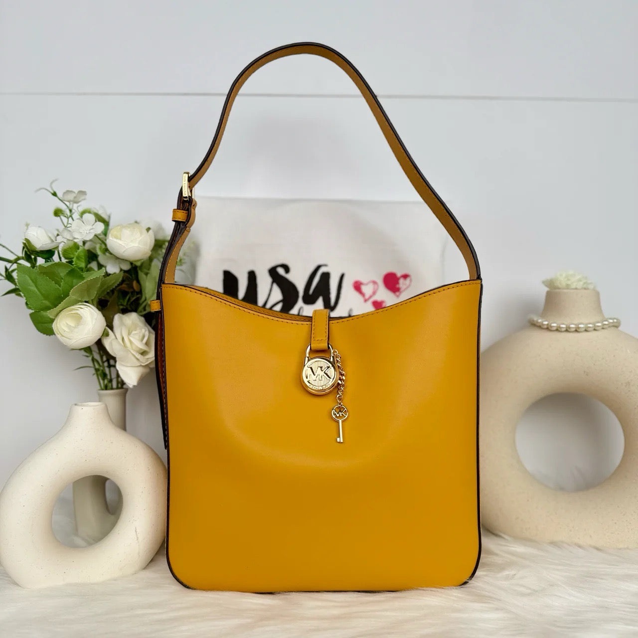 Elevate Your Style with the Michael Kors Lyra Small Bucket Shoulder Bag – A Luxury Accessible Like Never Before