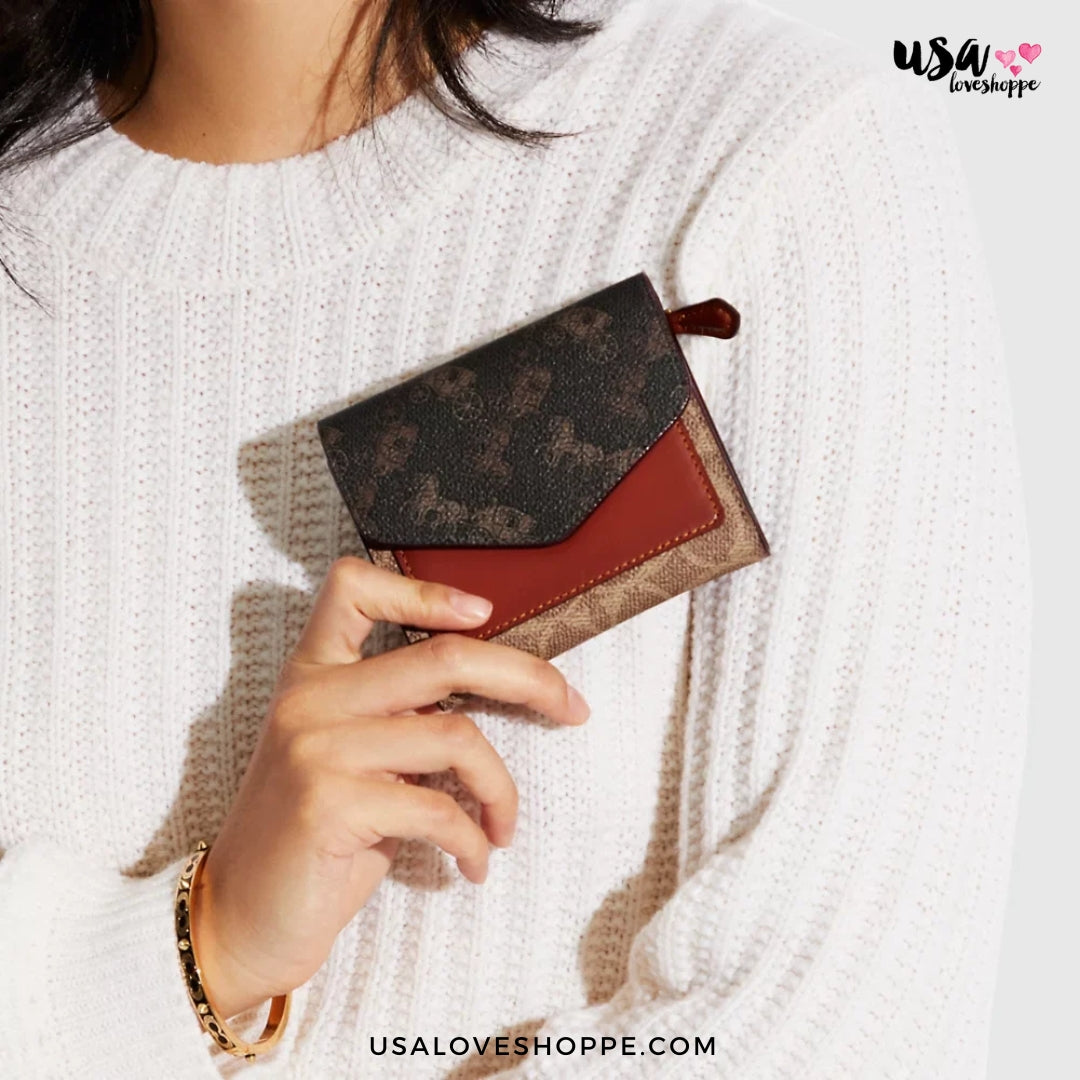 Discover the Timeless Elegance of Coach: The Wyn Small Wallet with Horse and Carriage Print