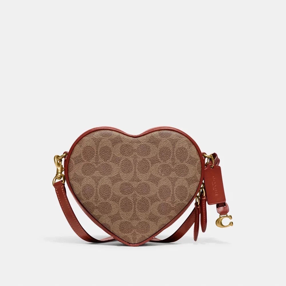 Discover the Quintessence of Love with the Coach Heart Crossbody in Signature Canvas