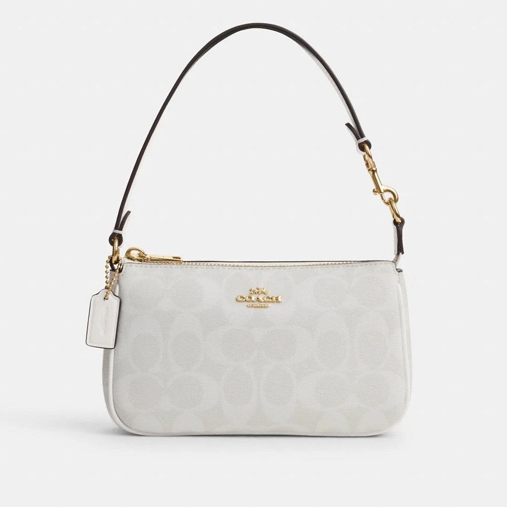 Discover Elegance with the Coach Nolita 19 in Signature Canvas