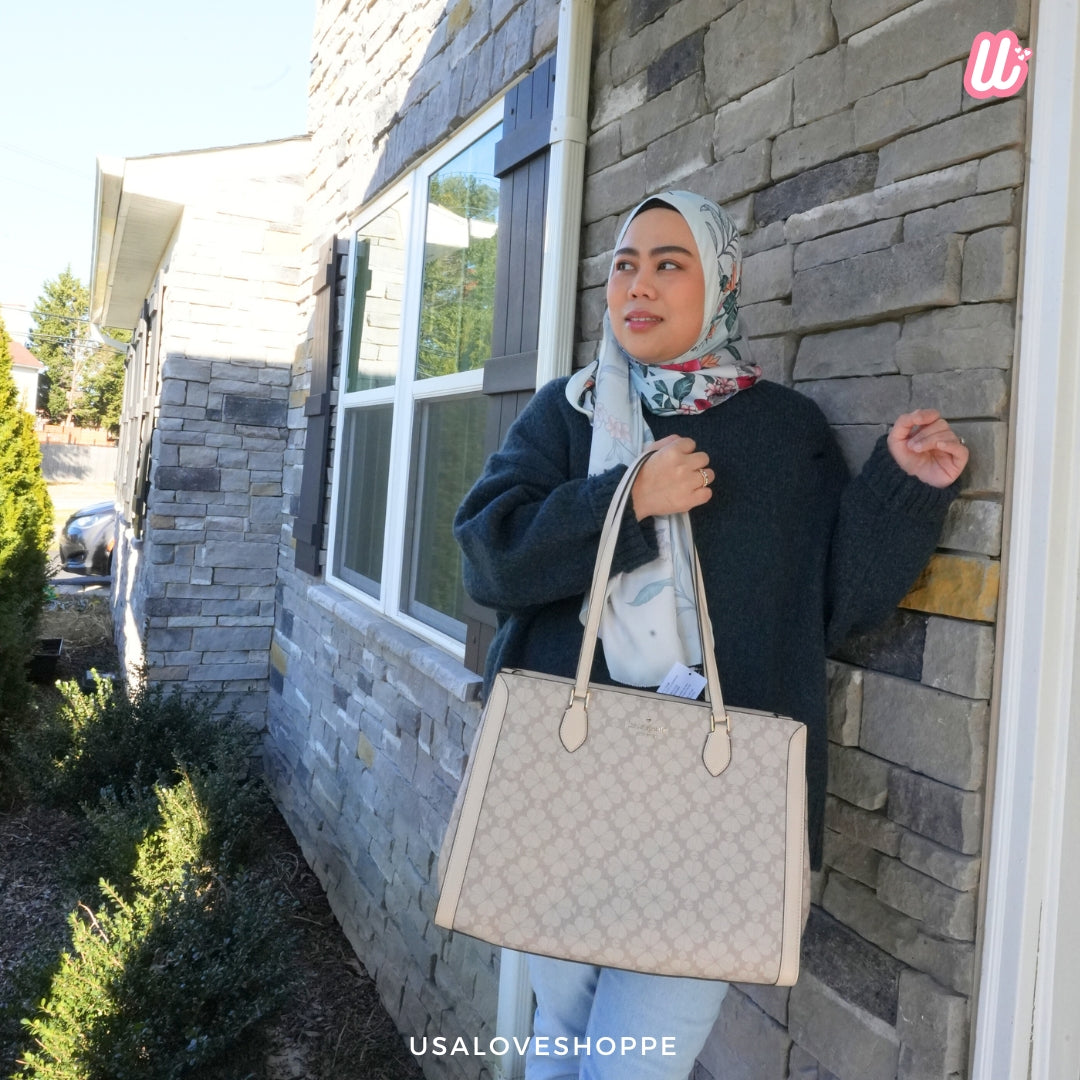 Unveiling the Ultimate Companion for Every Modern Woman: The Kate Spade Signature Spade Flower East-West Laptop Tote