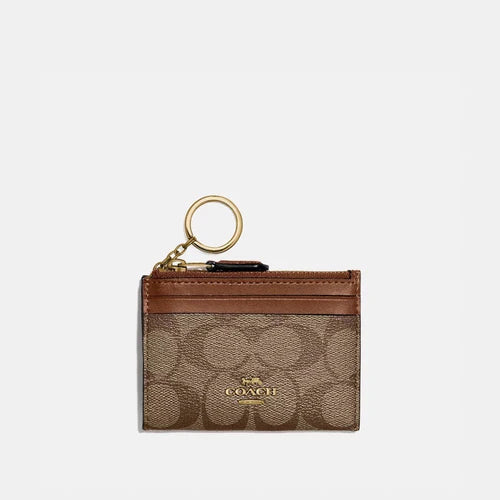 Experience Ultimate Luxury with the Coach Signature PVC Mini Skinny ID