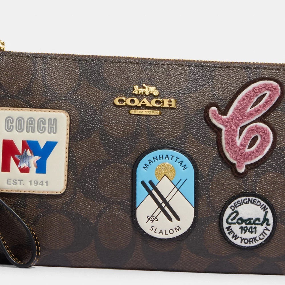 [READY STOCK MY] COACH Large Corner Zip Wristlet In Signature Canvas With Ski Patches in Brown Black Multi (CF457)